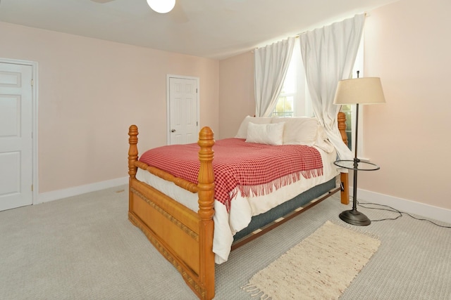 bedroom featuring light colored carpet