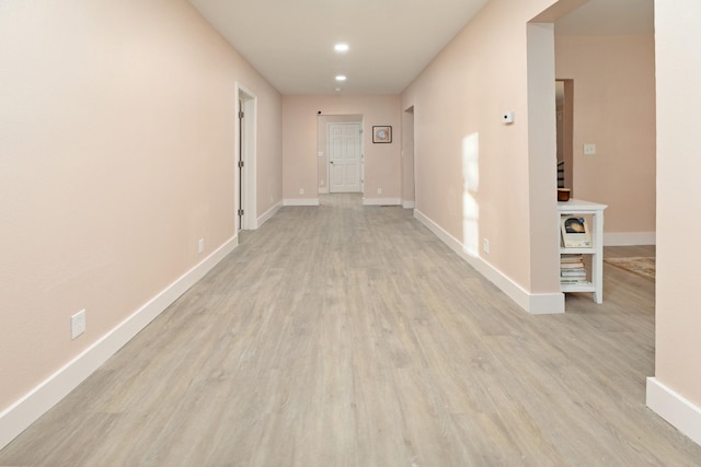 hall with light hardwood / wood-style floors