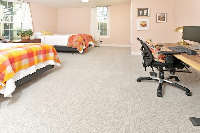 bedroom featuring light colored carpet