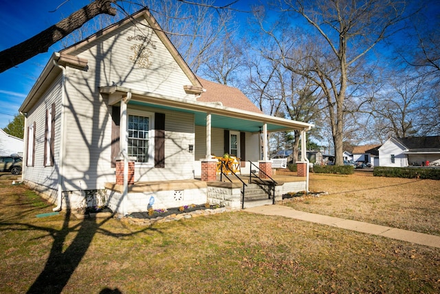 view of front facade with a porch and a front yard