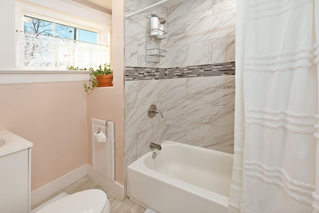 bathroom featuring shower / tub combo with curtain and toilet