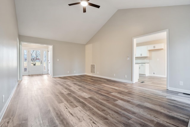 unfurnished living room with light hardwood / wood-style flooring, high vaulted ceiling, and ceiling fan