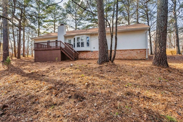 rear view of house with a deck