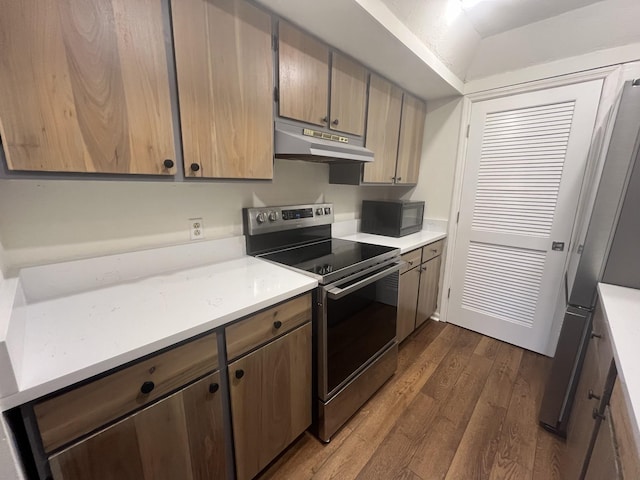 kitchen with dark hardwood / wood-style floors and stainless steel electric range