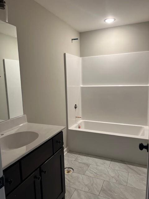 bathroom with vanity and shower / bathing tub combination