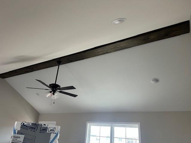 room details featuring ceiling fan and beamed ceiling