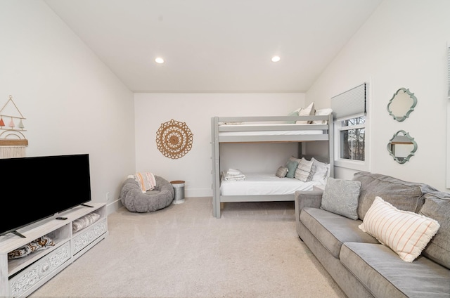 carpeted bedroom with vaulted ceiling