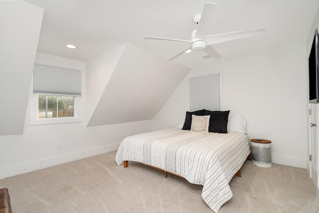 carpeted bedroom with lofted ceiling and ceiling fan