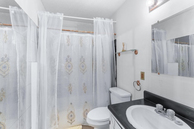 full bath featuring toilet, a textured ceiling, a shower with shower curtain, and vanity