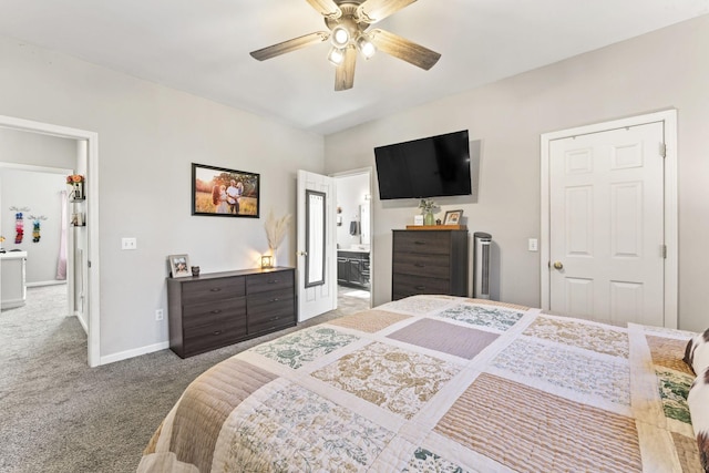 carpeted bedroom featuring connected bathroom and ceiling fan