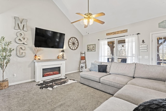 living room featuring ceiling fan, carpet flooring, high vaulted ceiling, and a wealth of natural light