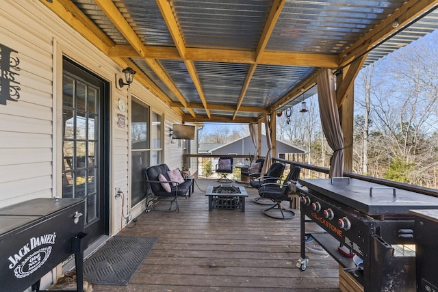 wooden deck with a fire pit