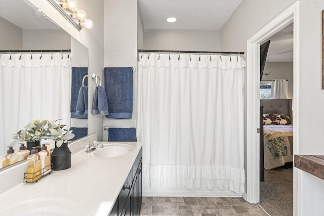 bathroom with vanity and shower / bath combination with curtain