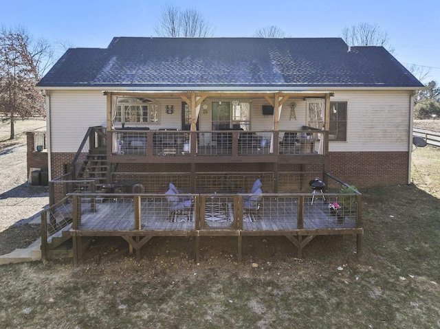 rear view of property with a deck