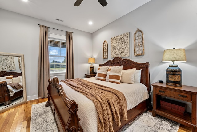 bedroom featuring ceiling fan and light hardwood / wood-style flooring