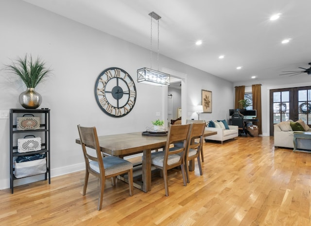 dining room with french doors, ceiling fan, and light hardwood / wood-style floors