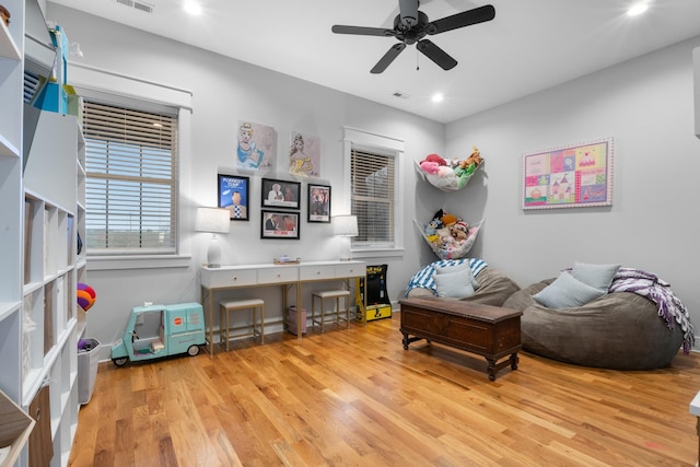 sitting room with light hardwood / wood-style flooring and ceiling fan