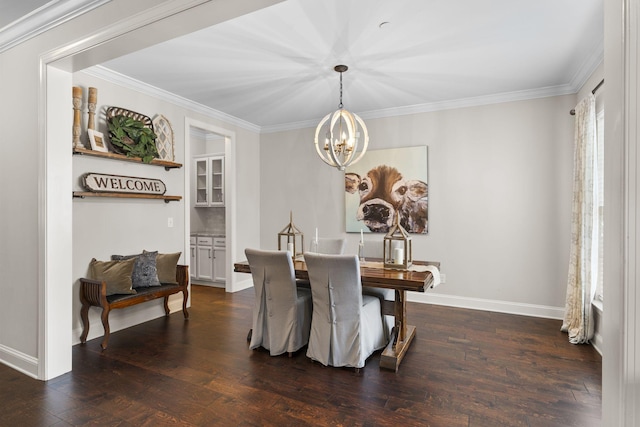 dining room featuring crown molding, dark hardwood / wood-style floors, and an inviting chandelier