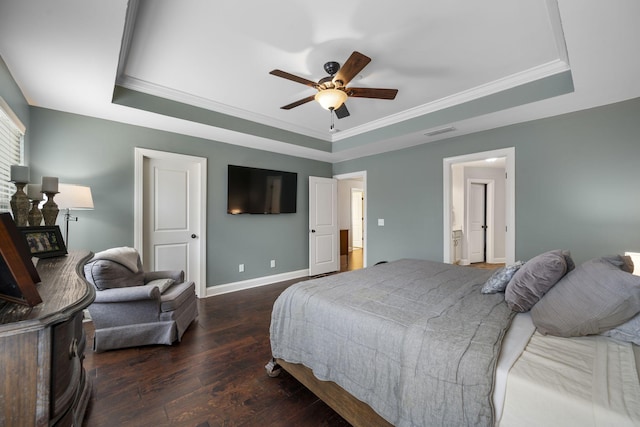 bedroom featuring crown molding, dark wood-type flooring, a raised ceiling, and ceiling fan