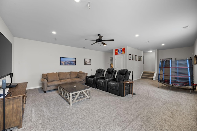 living room featuring ceiling fan and light carpet