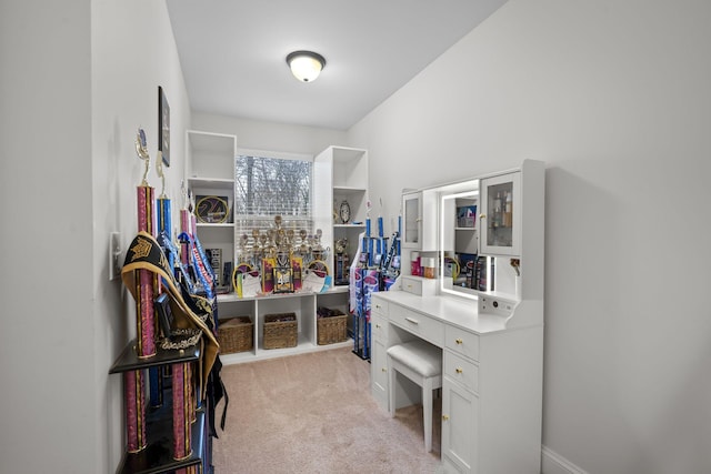 spacious closet featuring light carpet