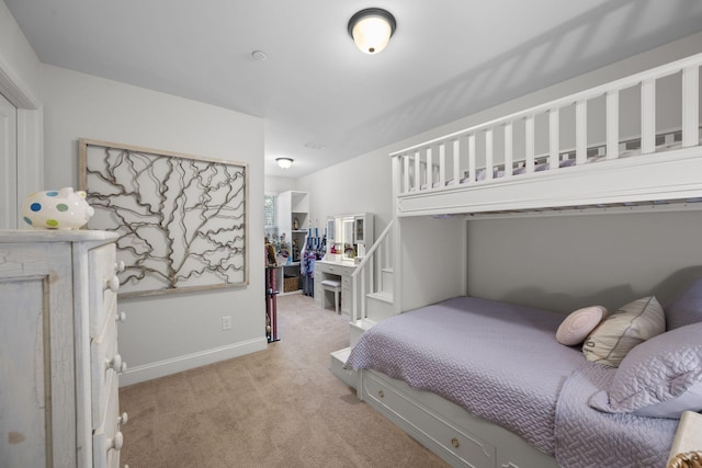 bedroom featuring light colored carpet