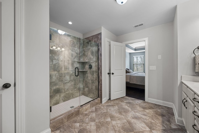 bathroom with an enclosed shower and vanity