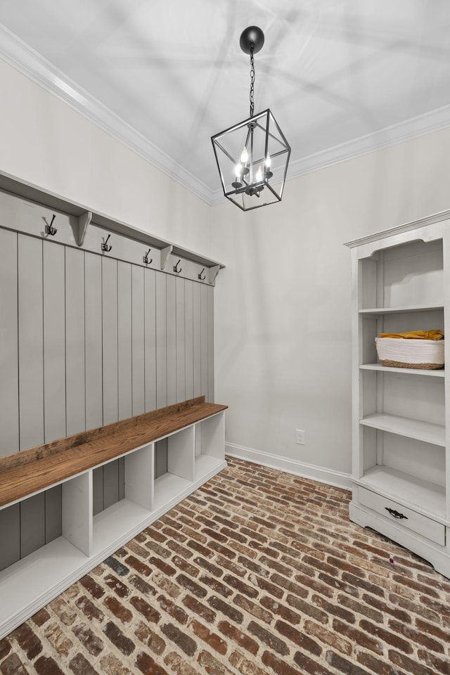 mudroom featuring an inviting chandelier and ornamental molding