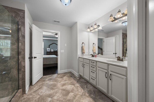 bathroom featuring vanity, a shower with door, and ceiling fan