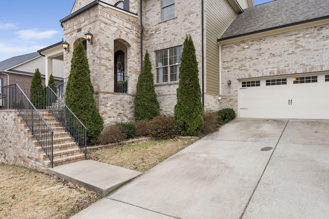 view of side of property with a garage