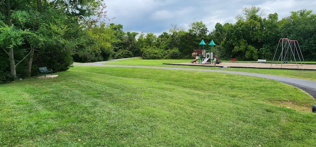 view of community with a lawn and a playground