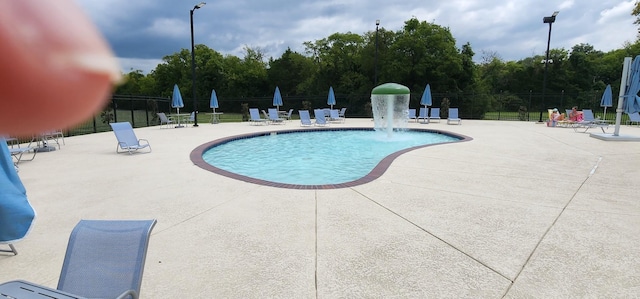 view of pool featuring a patio area