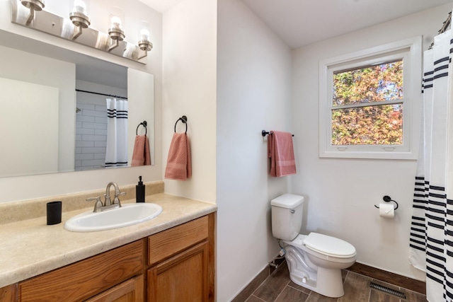 bathroom with vanity and toilet