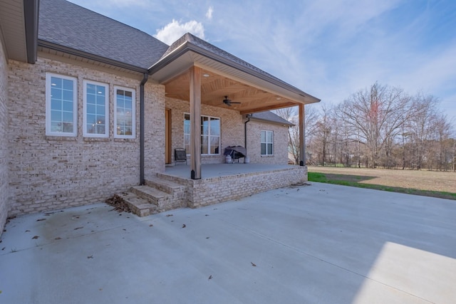 view of patio with ceiling fan and area for grilling