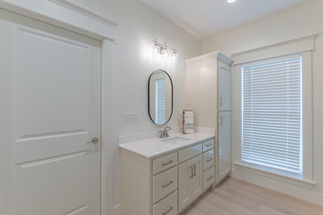 bathroom featuring hardwood / wood-style flooring and vanity