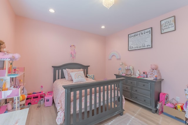 bedroom with light hardwood / wood-style floors