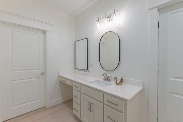 bathroom featuring vanity and hardwood / wood-style flooring