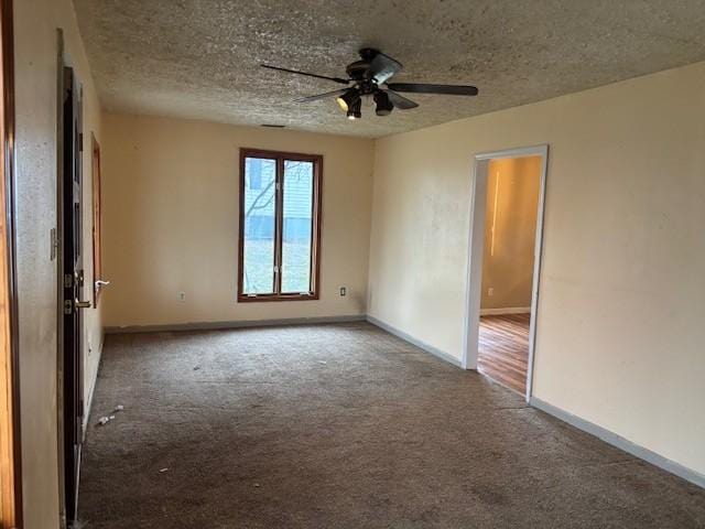 unfurnished room with ceiling fan, a textured ceiling, and carpet flooring