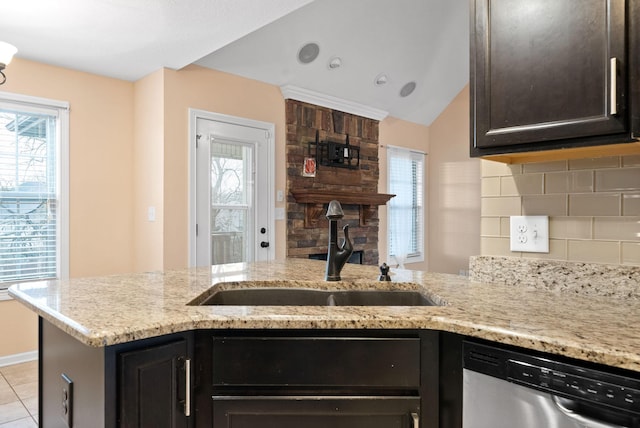 kitchen featuring tasteful backsplash, sink, plenty of natural light, and dishwasher