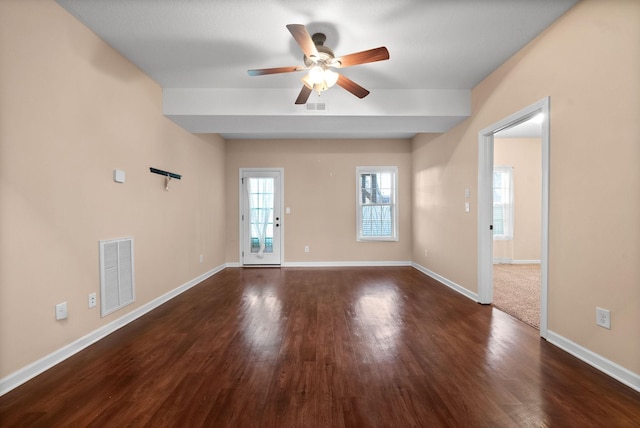 unfurnished room with ceiling fan and dark hardwood / wood-style flooring