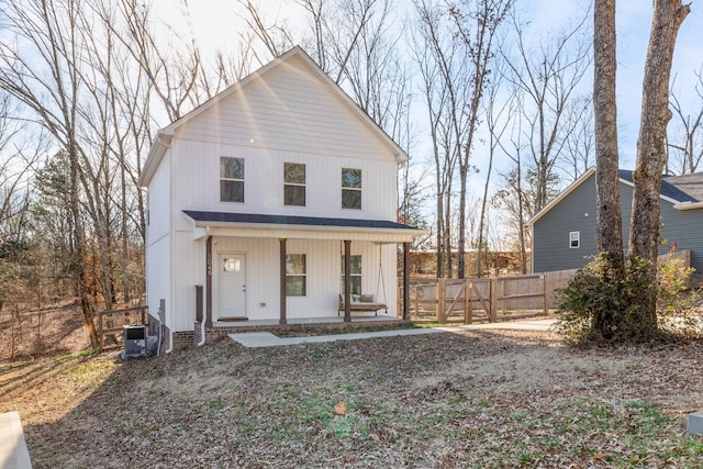 view of front of property featuring a porch and central air condition unit