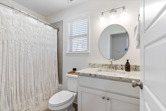 full bathroom featuring vanity, toilet, and shower / bath combo with shower curtain