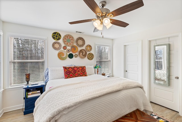 bedroom featuring ceiling fan and light wood-type flooring