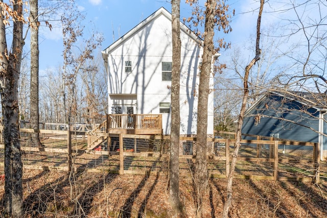 back of property featuring a deck