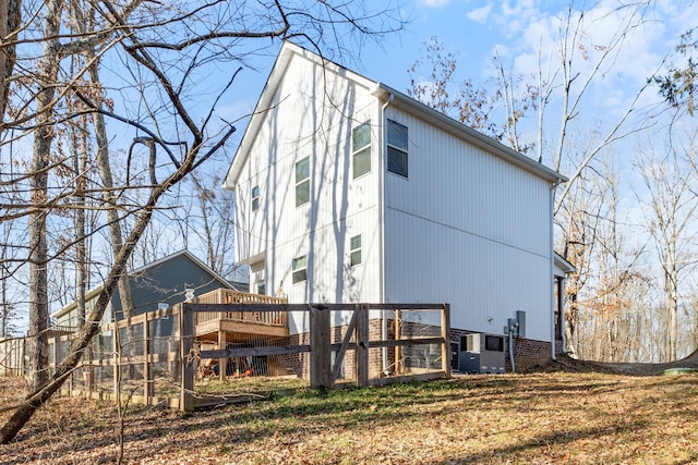 back of property featuring central AC unit