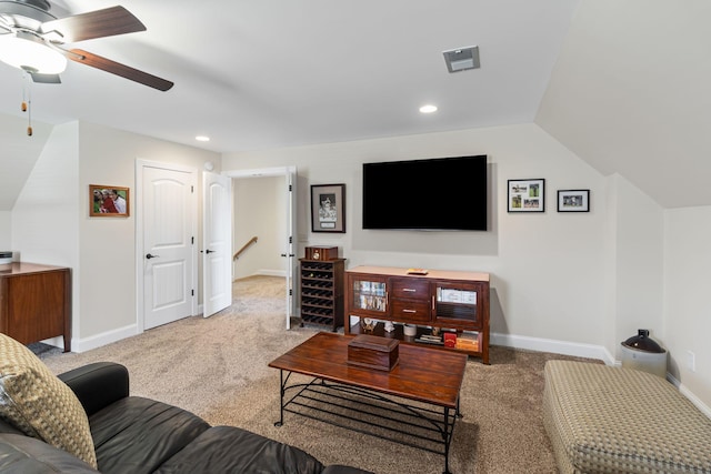 living room with vaulted ceiling, light colored carpet, and ceiling fan