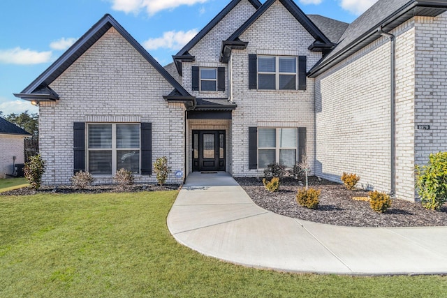 view of front of home featuring a front lawn and central air condition unit