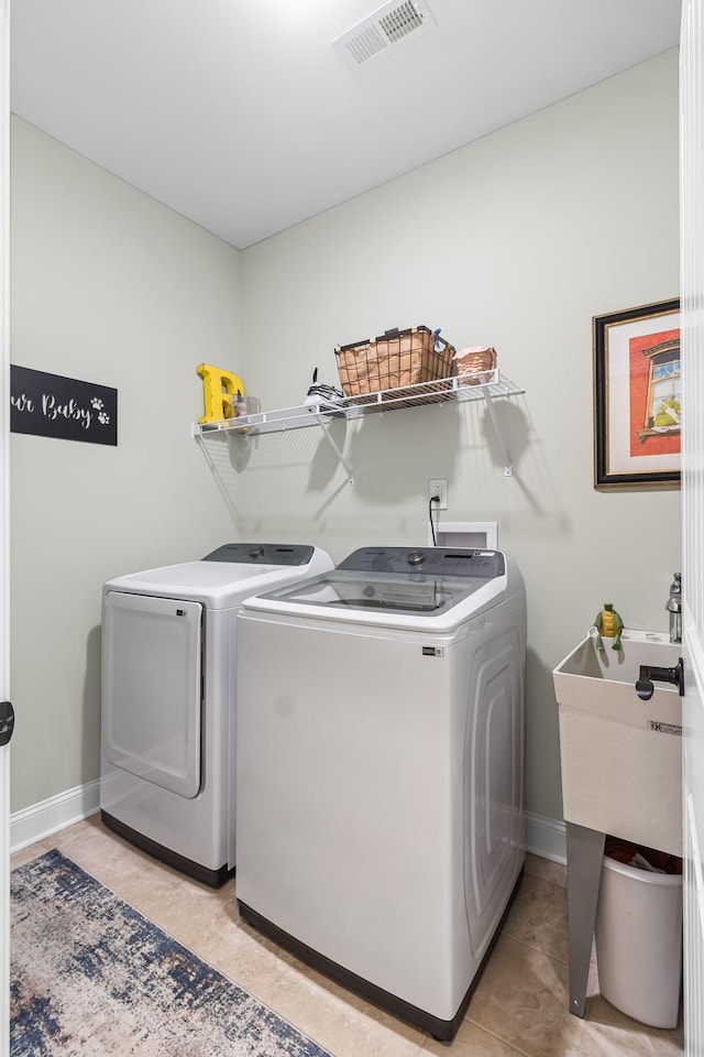 washroom with washing machine and clothes dryer