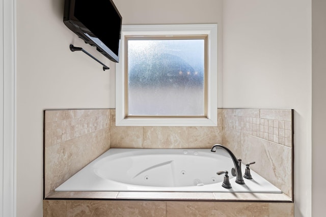 bathroom featuring tiled tub