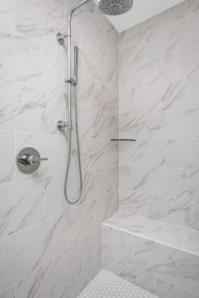 bathroom featuring tiled shower